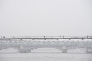 Commuters on the Millennium Bridge in London