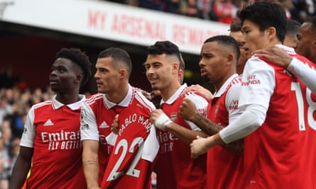 Gabriel Martinelli and Granit Xhaka hold up a Pablo Marí shirt after Arsenal’s opening goal against Nottingham Forest