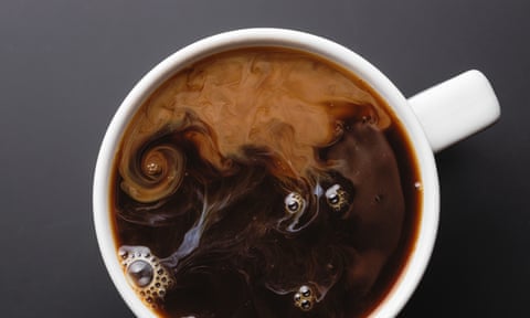 View from above coffee with swirling cream