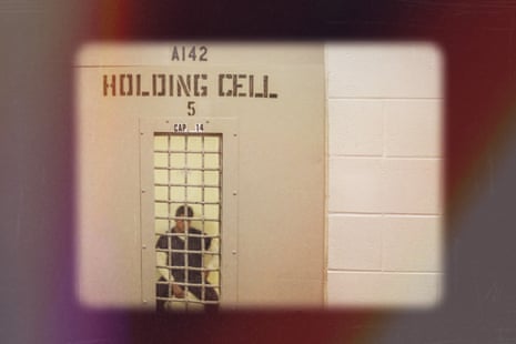 a man in a holding cell