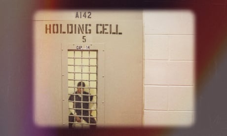 a man in a holding cell