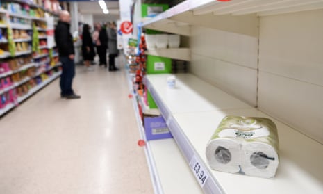 Empty toilet paper shelves at a supermarket in London on 12 March.
