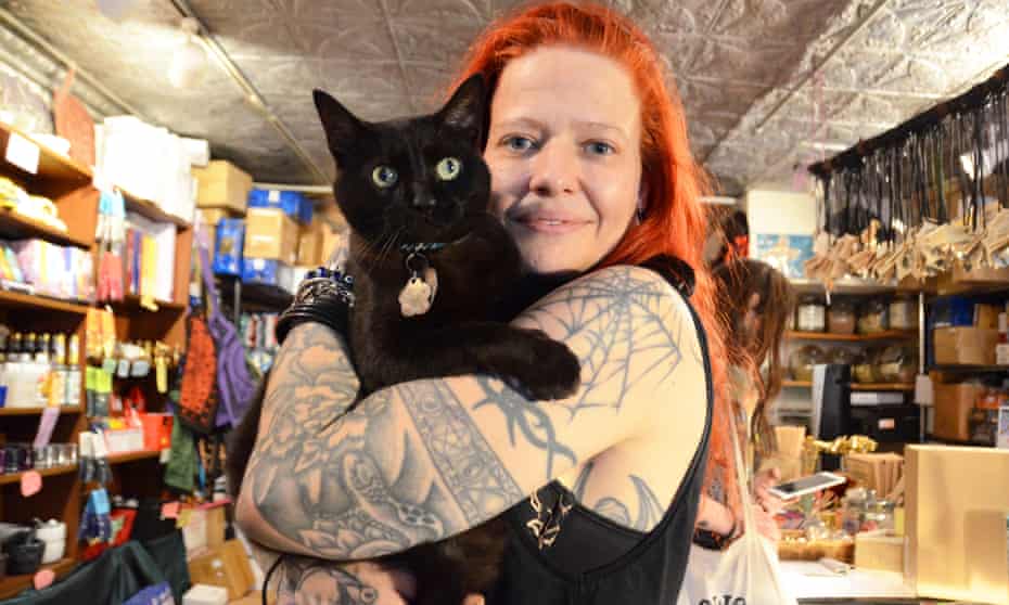 enchantments owner and witch stacy rapp with a resident cat