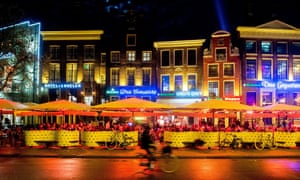 A cyclist travels through Grote Markt in Groningen.