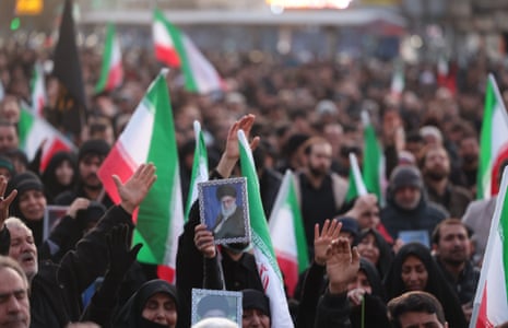 Crowds carry Iranian flags to mourn Supreme Leader Ayatollah Ali Khamenei, whose death was confirmed by state media.