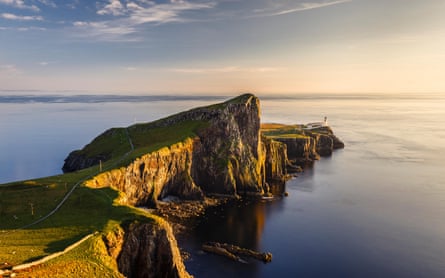 Cliffs, sea and lighthouse in evening light