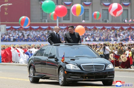 North Korea’s leader, Kim Jong-un, and Russia’s president, Vladimir Putin, parading around in an open-top car during a welcoming ceremony at Kim Il Sung Square in Pyongyang, June 2024
