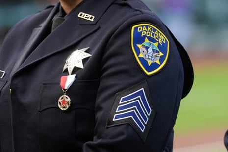 Oakland police department patch on shoulder of officer.