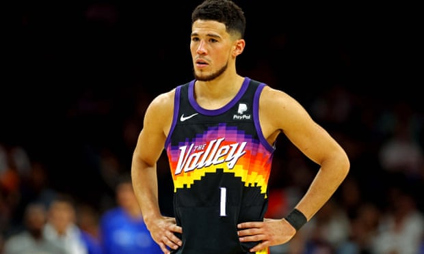 Devin Booker takes in the Suns’ loss on Sunday night