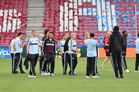 Players and staff of Aston Villa on the pitch at Stadion Salzburg.