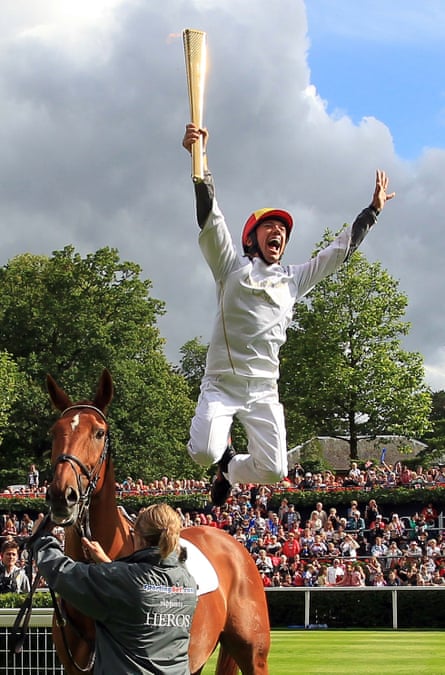 Frankie Dettori with the Olympic torch at Ascot in 2012