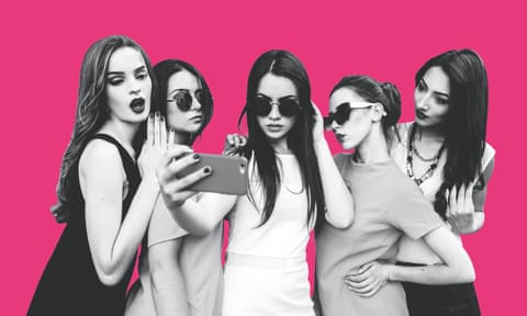 young women taking group selfie