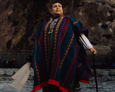 A woman in traditional Indigenous clothing.