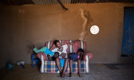 Sibongile Sibeko with her children Linda, four, left, and Jabulile, eight, right. The Sibeko family live on the edge of the coal mine in Arbor.