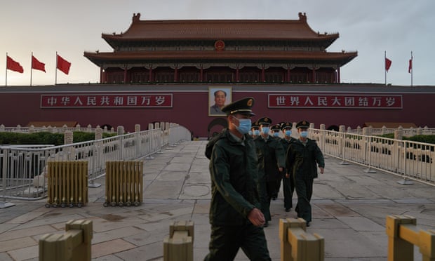  Members of the Chinese People’s Armed Police march through Tiananmen Gate