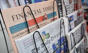 Newspapers on a news stand