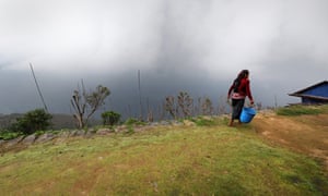 woman walking on a terrace in Sikles, Nepal