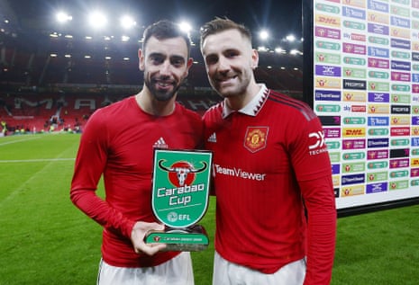 Manchester United’s Bruno Fernandes with the EFL Carabao Cup player of the match award and teammate Luke Shaw.