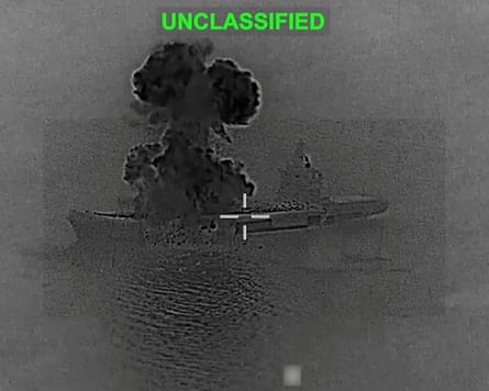 Dark image of ship and cloud of smoke with ‘Unclassified’ stamped on it