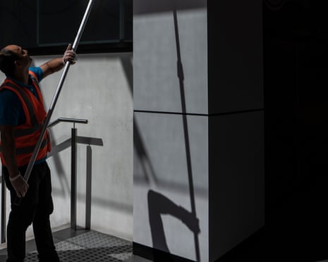 A cleaner is seen working in a shopping mall in Sydney