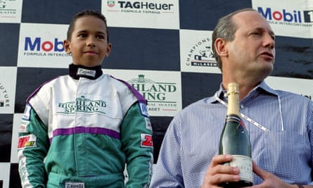 Lewis Hamilton winning a karting race in 1996, on the podium with McLaren boss Ron Dennis.