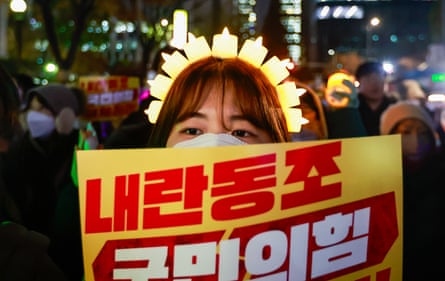 Demonstrations continue after parliament passed bill to investigate South Korean presidentSEOUL, SOUTH KOREA - 10 DECEMBER: People take part in a rally featuring K-POP musics to protest against South Korean Yoon Suk Yeol, after the parliament passed a bill to appoint a special counsel to investigate Yoon over his failed attempt to impose martial law, near the National Assembly, in Seoul, South Korea, on 10 December, 2024. After Yoon Suk Yeol survived an initial impeachment vote last week, the opposition will make a second attempt on December 12 to impeach the president, who has caused nationwide discontent with his decision to impose martial law on December 3 in the East Asian country. (Photo by Daniel Ceng/Anadolu via Getty Images)