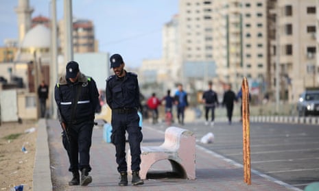 Police patrol the Gaza city seafront to enforce the territory’s coronavirus restrictions