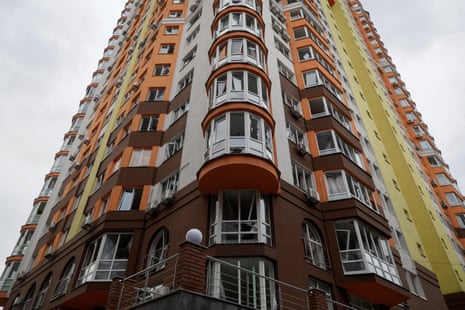 A view shows a residential building damaged by a Russian drone strike in Kyiv, 30 December.
