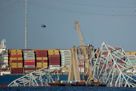 A crane works on the debris of the Francis Scott Key Bridge in Baltimore, Maryland, on 29 March. 