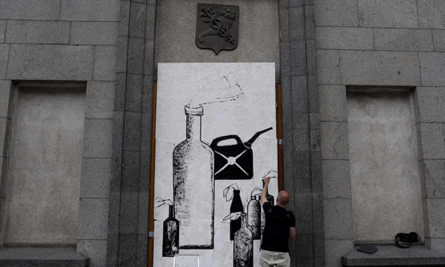 Ukrainian artist Gamlet Zinkivskiy works on his new painting, amid Russia’s attack on Ukraine, in Kharkiv, Ukraine.