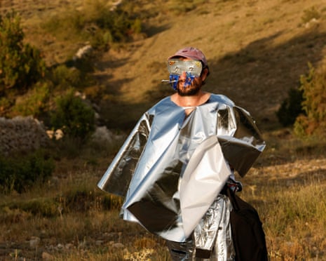 An artist uses self-made artefacts to observe a solar eclipse before totality near the small village of Castell de Cabres, Spain.