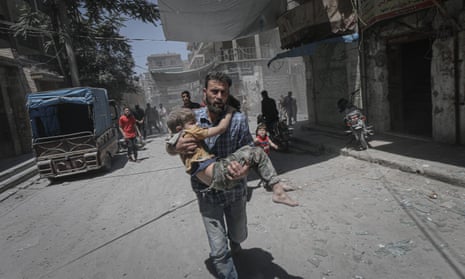 Civilians flee an airstrike in Idlib
