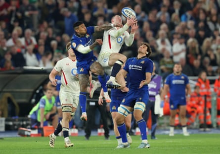 Tom Roebuck of England contends for the ball with Monty Ioane of Italy