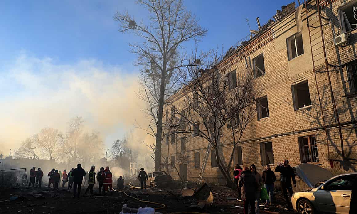 Rescue teams work at the site of Russian shelling near a residential building in Kharkiv, north-eastern Ukraine, on Friday.