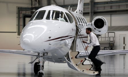 A co-pilot boards a private passenger aircraft at Farnborough airport in the south of England.