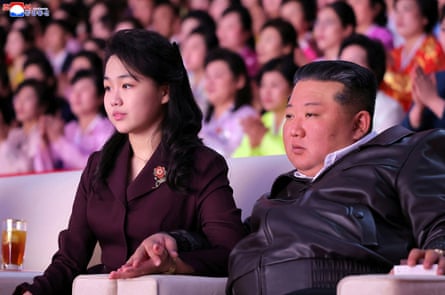 North Korean leader Kim Jong-un and his daughter attend an International Women's Day performance