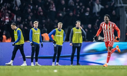 Sheraldo Becker celebrates as Hertha’s substitutes look on after Union’s second goal.