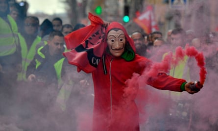 A demonstrator wears the red jumpsuit and Dali mask from the show during an anti-government protest in France.