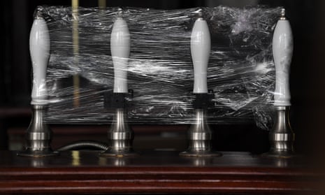 Beer pumps wrapped in cellophane.