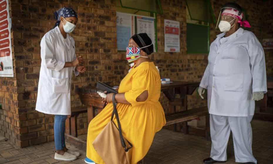 A South African woman is briefed before taking a Covid-19 test in Groblersdal, north-east of Johannesburg.