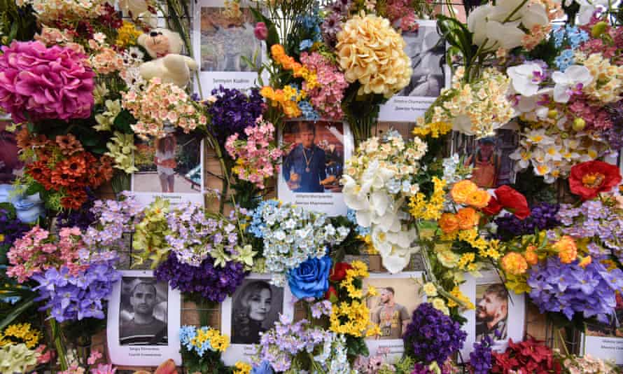 Photos of the victims of Russia’s military invasion of Ukraine are seen on the ‘Wall of Memory’ in Lviv.