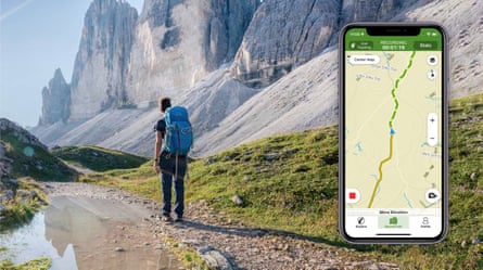 A picture of a person with a backpack walking along a mountainous road, with an inset of a phone with the Wikiloc app on screen