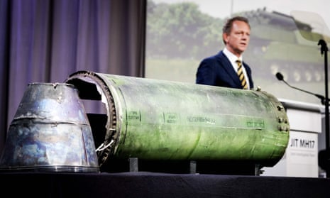 Fred Westerbeke , the chief prosecutor, stands next to a part of the Buk missile fired at MH17.