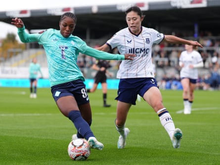 London City’s Grace Geyoro protects the ball from and Everton’s Rion Ishikawa.