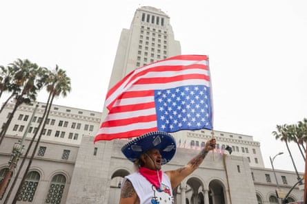 Person waves flag outside at protest