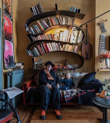 Ahead of the curve: Ron Arad with his grandson, in front of his prototype Bookworm shelf system.
