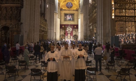 Worshipers attend a funeral Mass at Seville’s Cathedral.