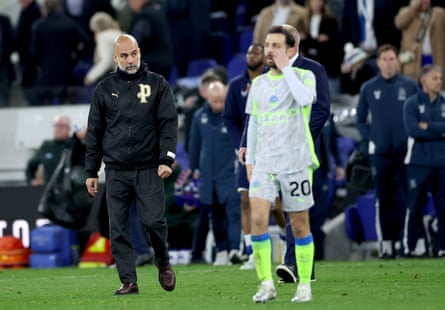 Pep Guardiola walks off the pitch at Everton