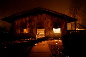 A commercial building burns in the Dixie fire near Greenville.