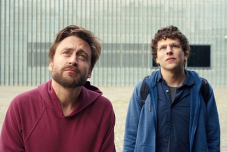 Kieran Culkin (left, in a red sweatshirt) and Jesse Eisenberg (in a blue sweatshirt) in A Real Pain.